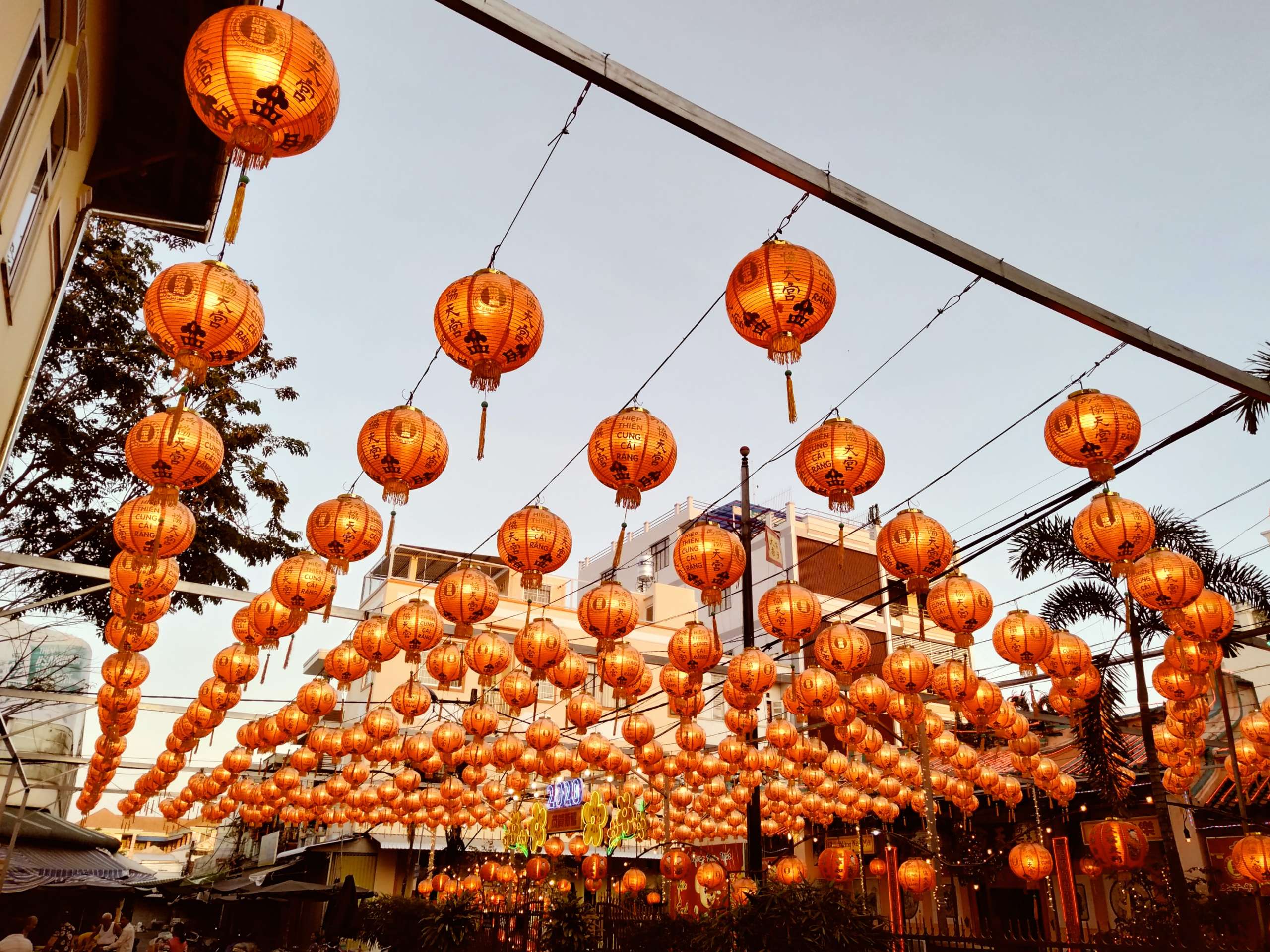 Chinese lantern illuminate an overhead structure, celebrating the Lunar New Year
